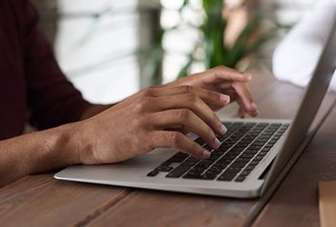 Insights person using macbook